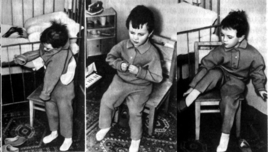 Putting on this suit independently has taken many days of learning
Buttoning up is the conclusive stage in learning the skill of dressing oneself
Putting on the slippers right is not such an easy task either