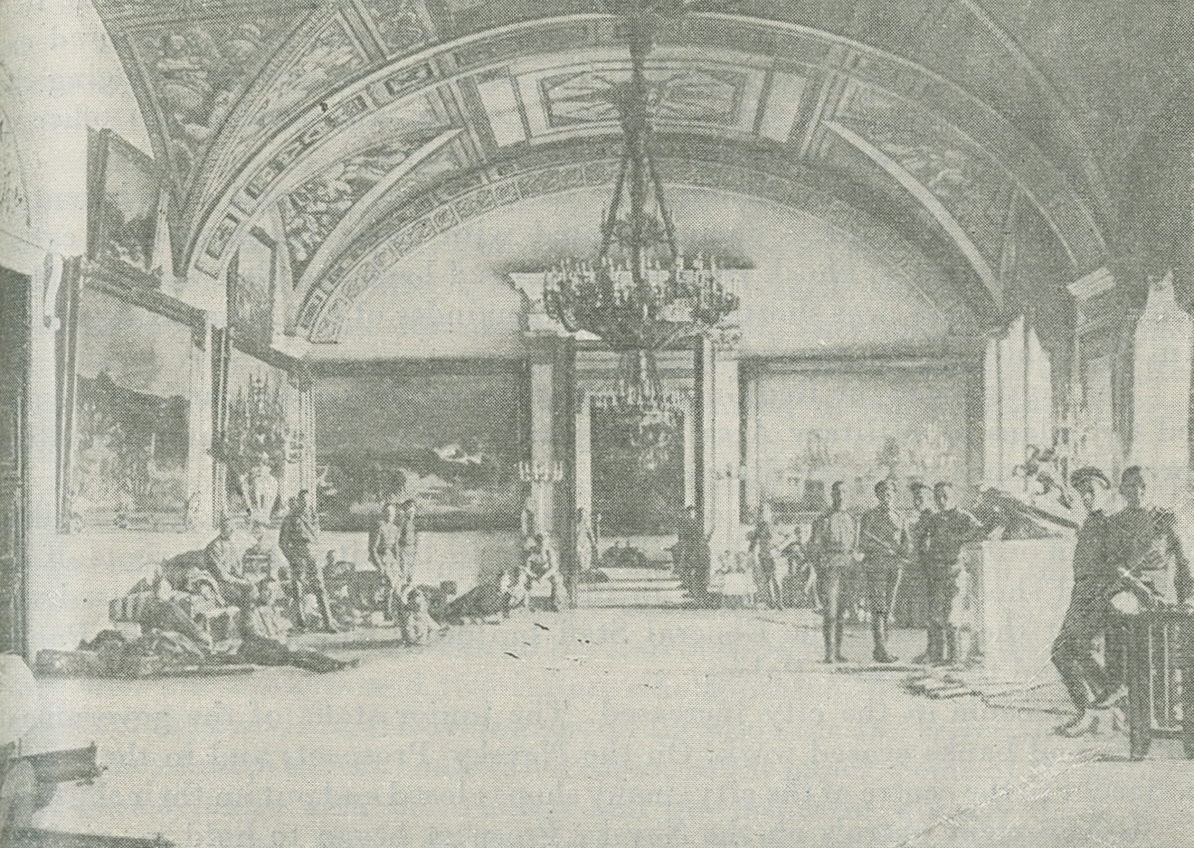 Photograph of Cadets sitting and standing in a large room with vaulted ceilings inside the Winter Palace